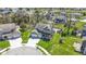 Aerial view of a beautiful home showcasing a pool, playset, and meticulously maintained lawn at 15385 Ellington Dr, Fishers, IN 46040