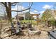 Serene backyard firepit with comfortable seating and a view of the lush surroundings; perfect for relaxation at 15385 Ellington Dr, Fishers, IN 46040