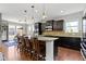 Well-appointed kitchen with a large island, pendant lighting, and seating for gathering at 15385 Ellington Dr, Fishers, IN 46040