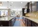 A well-designed kitchen showcases a spacious island, modern appliances, and a seamless transition to the dining area at 15385 Ellington Dr, Fishers, IN 46040