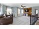 Second floor living room featuring a media wall and large windows with natural light at 15385 Ellington Dr, Fishers, IN 46040