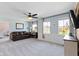 Living room featuring light blue walls, plush carpet, and a large window with natural light at 15385 Ellington Dr, Fishers, IN 46040