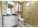 This bathroom features a white vanity, a framed mirror, a toilet, and neutral colored walls at 15501 Landsbrook E Run, Noblesville, IN 46060