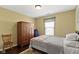 Comfortable bedroom with natural light, wooden furniture, and neutral decor at 15501 Landsbrook E Run, Noblesville, IN 46060