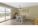 Bright dining area with access to the patio and view of the backyard at 15501 Landsbrook E Run, Noblesville, IN 46060