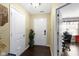 Bright entryway featuring tile flooring, a white front door, and a plant at 15501 Landsbrook E Run, Noblesville, IN 46060