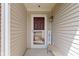 Cozy front porch with a storm door and welcome sign at 15501 Landsbrook E Run, Noblesville, IN 46060