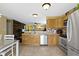 Spacious kitchen featuring stainless steel appliances, and access to the living area at 15501 Landsbrook E Run, Noblesville, IN 46060