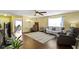 Cozy living room with hardwood floors, ceiling fan, and comfortable seating arrangement at 15501 Landsbrook E Run, Noblesville, IN 46060