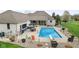 Aerial view of a home with a pool, an outdoor bar, a hot tub, and an outdoor seating area at 1583 E Osprey Dr, Greenfield, IN 46140