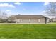 Spacious three-car garage and beautifully manicured lawn at 1583 E Osprey Dr, Greenfield, IN 46140