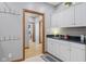 Mudroom with sink and cabinet space with entry to another room at 1583 E Osprey Dr, Greenfield, IN 46140
