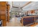 Open concept living room with hardwood floors, built-in bookshelves, and backyard views at 1583 E Osprey Dr, Greenfield, IN 46140
