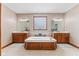 Luxurious bathroom featuring a soaking tub, double vanities, and natural light from glass block window at 1583 E Osprey Dr, Greenfield, IN 46140