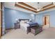 Comfortable main bedroom with a trey ceiling, a king-size bed, and elegant decor at 1583 E Osprey Dr, Greenfield, IN 46140
