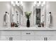 Elegant bathroom featuring double sinks, a large mirror, and stylish fixtures, designed for comfort and convenience at 1712 Rosette Way, Indianapolis, IN 46202