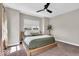 Cozy bedroom with a platform bed, neutral decor, and large window providing natural light for a relaxing atmosphere at 1712 Rosette Way, Indianapolis, IN 46202