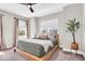Bright bedroom with a platform bed, large windows, and soft decor creating a comfortable and inviting space at 1712 Rosette Way, Indianapolis, IN 46202