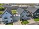 Contemporary townhouses feature private rooftop decks and attached garages, perfect for urban living at 1712 Rosette Way, Indianapolis, IN 46202