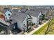 Modern townhome showcases sleek architecture, a fenced yard, and charming curb appeal at 1712 Rosette Way, Indianapolis, IN 46202
