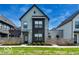 Charming two-story home with modern design elements and a well-manicured front yard at 1712 Rosette Way, Indianapolis, IN 46202