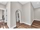 Bright hallway with wood flooring, a stylish mirror, and access to multiple rooms at 1712 Rosette Way, Indianapolis, IN 46202