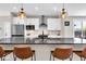 Bright kitchen with stainless steel appliances, a dark stone countertop, and modern pendant lighting at 1712 Rosette Way, Indianapolis, IN 46202