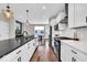 Modern kitchen featuring white cabinetry, stainless appliances, and a sleek countertop with a gas range at 1712 Rosette Way, Indianapolis, IN 46202