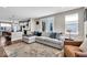 Open-concept living room featuring a comfortable sectional sofa and seamless flow to the kitchen at 1712 Rosette Way, Indianapolis, IN 46202
