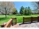 View from a wooden back deck showcasing the sprawling, green backyard and mature trees at 1927 Pheasant Way, Greenwood, IN 46143