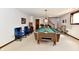 Spacious finished basement with a pool table, stairs leading up, and recreation space at 1927 Pheasant Way, Greenwood, IN 46143