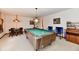 Basement game room with a pool table and a cozy seating area at 1927 Pheasant Way, Greenwood, IN 46143