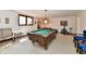 Finished basement featuring a pool table, exercise equipment, and ample space at 1927 Pheasant Way, Greenwood, IN 46143