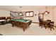 Recreational basement area with a pool table, dining table and stairs leading up at 1927 Pheasant Way, Greenwood, IN 46143