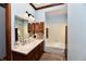 Bathroom boasts a vanity with cabinets, a bathtub, and a bright skylight offering functionality and style at 1927 Pheasant Way, Greenwood, IN 46143