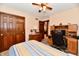 Bedroom with a desk area, neutral walls, ceiling fan, and closet space offers comfortable living and convenience at 1927 Pheasant Way, Greenwood, IN 46143