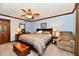 Cozy bedroom featuring a ceiling fan, soft lighting, and a plush bed, perfect for relaxation and rest at 1927 Pheasant Way, Greenwood, IN 46143