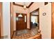 Inviting entryway with tile flooring, a chandelier, and views into the living room at 1927 Pheasant Way, Greenwood, IN 46143