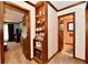 Hallway with built-in shelving provides a stylish transition between rooms, enhancing the home's character at 1927 Pheasant Way, Greenwood, IN 46143