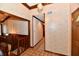 Hallway with a tiled floor, wood trim and doorways leading to other rooms at 1927 Pheasant Way, Greenwood, IN 46143