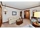 Bright living room with a floral sofa, glass coffee table, and decorative touches at 1927 Pheasant Way, Greenwood, IN 46143