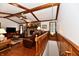 Upstairs living room featuring a brick fireplace, ceiling fan, and hardwood floors at 1927 Pheasant Way, Greenwood, IN 46143