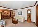 Comfortable living room featuring a sofa, grandfather clock, and dining room view at 1927 Pheasant Way, Greenwood, IN 46143
