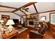 Spacious living area with a fireplace, ceiling fan, and hardwood floors at 1927 Pheasant Way, Greenwood, IN 46143