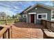 Back deck offers additional outdoor living space with wooden railings and backyard views at 1942 E Edgewood Ave, Indianapolis, IN 46227