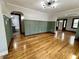 Elegant living room featuring hardwood floors, stylish wall paneling, and modern lighting at 1942 E Edgewood Ave, Indianapolis, IN 46227