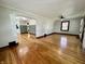 Open-concept living room featuring hardwood floors, ample natural light, and a seamless layout at 1942 E Edgewood Ave, Indianapolis, IN 46227