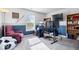 This room includes a workspace with multiple monitors, a comfy chair, and decor to inspire productivity at 19510 Pathway Point, Noblesville, IN 46062