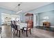 Spacious dining room features wood floors, traditional furniture, and a modern chandelier at 19510 Pathway Point, Noblesville, IN 46062