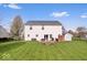 This home boasts a spacious yard, outdoor seating, and a shed for extra storage space at 19510 Pathway Point, Noblesville, IN 46062